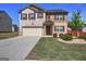 Two-story home featuring brick accents, vinyl siding, a two-car garage, and landscaped front yard at 237 Cranapple Ln, Mcdonough, GA 30253
