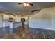Living room with hardwood floors, open to a modern kitchen featuring stainless steel appliances and an island at 237 Cranapple Ln, Mcdonough, GA 30253