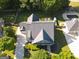 An aerial view of a beautiful home with a large roof, well-maintained yard and some trees at 330 Bay Grove Rd, Loganville, GA 30052