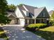 Charming home featuring a three-car garage, a covered porch, and well-maintained landscaping at 330 Bay Grove Rd, Loganville, GA 30052