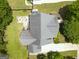 An aerial view showcasing the house and its outdoor entertaining area with a firepit at 330 Bay Grove Rd, Loganville, GA 30052