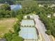 An aerial view of community amenities including a pool, tennis courts, and a nearby lake at 330 Bay Grove Rd, Loganville, GA 30052