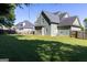 Large, green backyard with ample space, privacy fence, and a tranquil setting for outdoor enjoyment at 330 Bay Grove Rd, Loganville, GA 30052