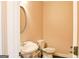 Half bathroom featuring a pedestal sink and oval mirror for added elegance at 330 Bay Grove Rd, Loganville, GA 30052
