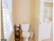 Bright bathroom with tiled floor, blinds and white toilet at 330 Bay Grove Rd, Loganville, GA 30052