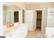 Elegant Primary bathroom featuring double vanity and walk-in closet at 330 Bay Grove Rd, Loganville, GA 30052
