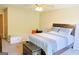 Bedroom with ceiling fan, storage chest, storage bench, and a bed at 330 Bay Grove Rd, Loganville, GA 30052