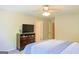 Bedroom with TV on dresser and a ceiling fan at 330 Bay Grove Rd, Loganville, GA 30052