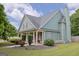 Charming home featuring a covered porch, a chimney, and a well-maintained lawn at 330 Bay Grove Rd, Loganville, GA 30052