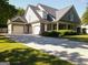 Charming home featuring a three-car garage, a covered porch, and well-maintained landscaping at 330 Bay Grove Rd, Loganville, GA 30052