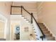 Foyer with staircase and view into living room at 330 Bay Grove Rd, Loganville, GA 30052