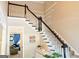 Foyer with staircase and view into living room at 330 Bay Grove Rd, Loganville, GA 30052