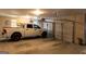A white truck is parked in a clean and open two car garage, ready for use and storage at 330 Bay Grove Rd, Loganville, GA 30052