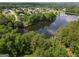 Beautiful aerial view of a serene lake surrounded by lush trees and established residences in the neighborhood at 330 Bay Grove Rd, Loganville, GA 30052