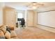 Spacious living room with plush carpeting, a ceiling fan, and a comfortable sofa at 330 Bay Grove Rd, Loganville, GA 30052