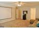 Inviting living room featuring neutral tones, carpet, and a mounted projector screen at 330 Bay Grove Rd, Loganville, GA 30052