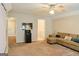 Inviting living room featuring neutral tones, carpet, and a comfortable sofa at 330 Bay Grove Rd, Loganville, GA 30052