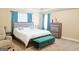 Main bedroom featuring a sitting area, neutral decor, and an ensuite bath at 330 Bay Grove Rd, Loganville, GA 30052