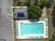 Aerial view of pool and clubhouse near parking; offers amenities for relaxation and recreation at 330 Bay Grove Rd, Loganville, GA 30052