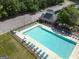 Community pool surrounded by lounge chairs, umbrellas and parking, perfect for a relaxing day at 330 Bay Grove Rd, Loganville, GA 30052