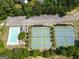 Aerial view of community tennis and pickleball courts near the pool and parking area at 330 Bay Grove Rd, Loganville, GA 30052