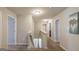 Bright hallway featuring neutral paint, carpet flooring, and an open staircase to the lower level at 2276 Waycross Ln # 21, Dacula, GA 30019