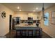 Bright kitchen featuring white cabinets, a granite island with seating, and stainless steel appliances at 2276 Waycross Ln # 21, Dacula, GA 30019