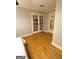 Bedroom area with hardwood floors and French doors to other room at 242 Adair St, Decatur, GA 30030