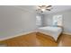 Bedroom featuring hardwood floors, ceiling fan, and natural light at 242 Adair St, Decatur, GA 30030