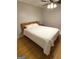 Bedroom features hardwood floors, ceiling fan, and a comfortable bed at 242 Adair St, Decatur, GA 30030