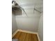 Walk-in closet features hardwood floors and metal rack shelving for storage at 242 Adair St, Decatur, GA 30030