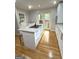 Bright eat-in kitchen with granite countertops, island cooktop, and access to the backyard at 242 Adair St, Decatur, GA 30030