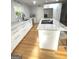 Well-lit kitchen showcases marble countertops, stainless steel appliances, and a central island at 242 Adair St, Decatur, GA 30030