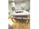 Bright eat-in kitchen features marble countertops, stainless steel appliances, and seating at 242 Adair St, Decatur, GA 30030