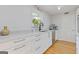 Bright and modern kitchen featuring marble counters, undermount sink and stainless-steel appliances at 242 Adair St, Decatur, GA 30030
