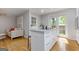 Bright kitchen features a marble island with sleek, stainless-steel appliances and ample cabinet space at 242 Adair St, Decatur, GA 30030