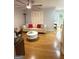 Bright living room features a ceiling fan and a white sofa with colorful cushions at 242 Adair St, Decatur, GA 30030