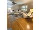 Living room features hardwood floors, shuttered windows and a large sectional sofa at 242 Adair St, Decatur, GA 30030