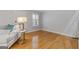 Well-lit living area features hardwood floors, neutral walls, and a comfortable sofa at 242 Adair St, Decatur, GA 30030