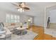 Spacious living area features hardwood floors, neutral walls, and modern ceiling fan at 242 Adair St, Decatur, GA 30030