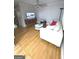 Cozy living room featuring hardwood floors, a ceiling fan, and comfortable seating at 242 Adair St, Decatur, GA 30030