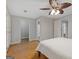 Spacious main bedroom features hardwood floors, a ceiling fan, and ensuite bathroom access at 242 Adair St, Decatur, GA 30030