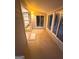 Enclosed sunroom offering natural light, neutral paint, and tile flooring throughout at 242 Adair St, Decatur, GA 30030