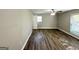 Bedroom showcasing new flooring, ceiling fan and sunlit windows at 1991 Turner Se Rd, Atlanta, GA 30315