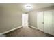 Bedroom with neutral carpet and white closet doors at 1991 Turner Se Rd, Atlanta, GA 30315