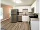 Kitchen featuring stainless steel appliances, granite countertops, and white cabinetry at 1991 Turner Se Rd, Atlanta, GA 30315