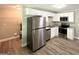 Kitchen featuring stainless steel appliances, granite countertops, and white cabinetry at 1991 Turner Se Rd, Atlanta, GA 30315