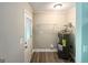 Well-lit utility room with water heater and storage shelving at 1991 Turner Se Rd, Atlanta, GA 30315