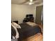 Bedroom with hardwood floors, desk and computer setup at 211 Groveland Dr, Peachtree City, GA 30269