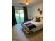 Bedroom with carpet, curtains and backyard view at 211 Groveland Dr, Peachtree City, GA 30269